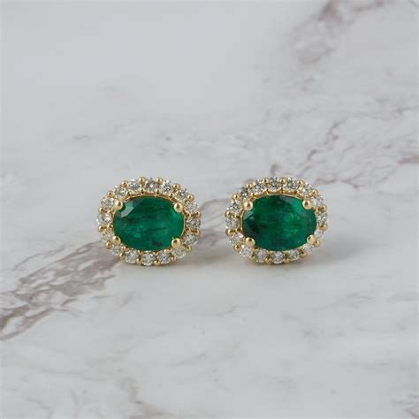 aretes en oro amarillo de 18kt con esmeralda 